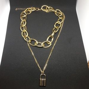 Gold tone layered lock necklace